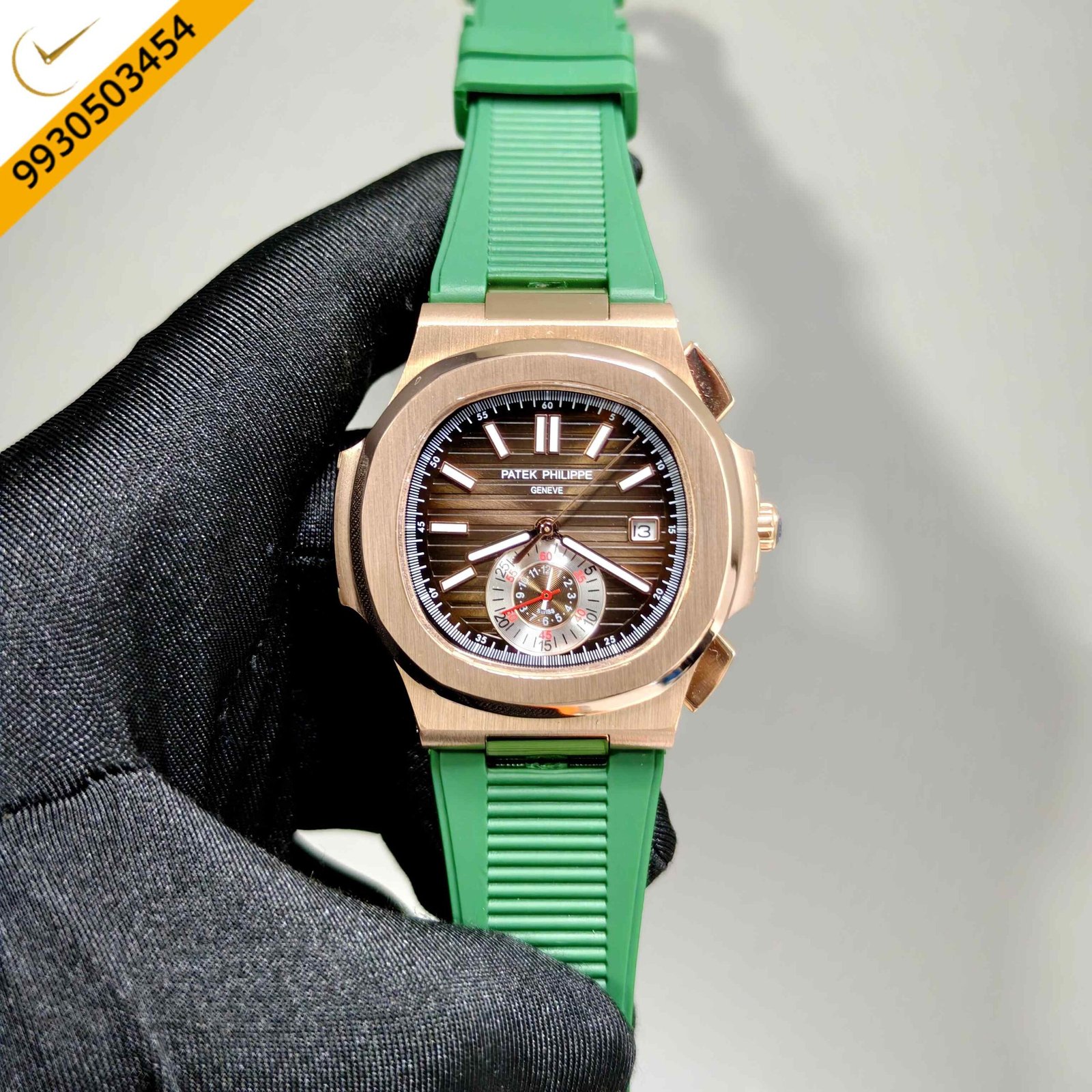 Patek Philippe Nautilus polished gold Swiss automatic watch featuring a rich brown dial, premium green rubber strap, iconic luxury sports design, and precision Swiss automatic movement.