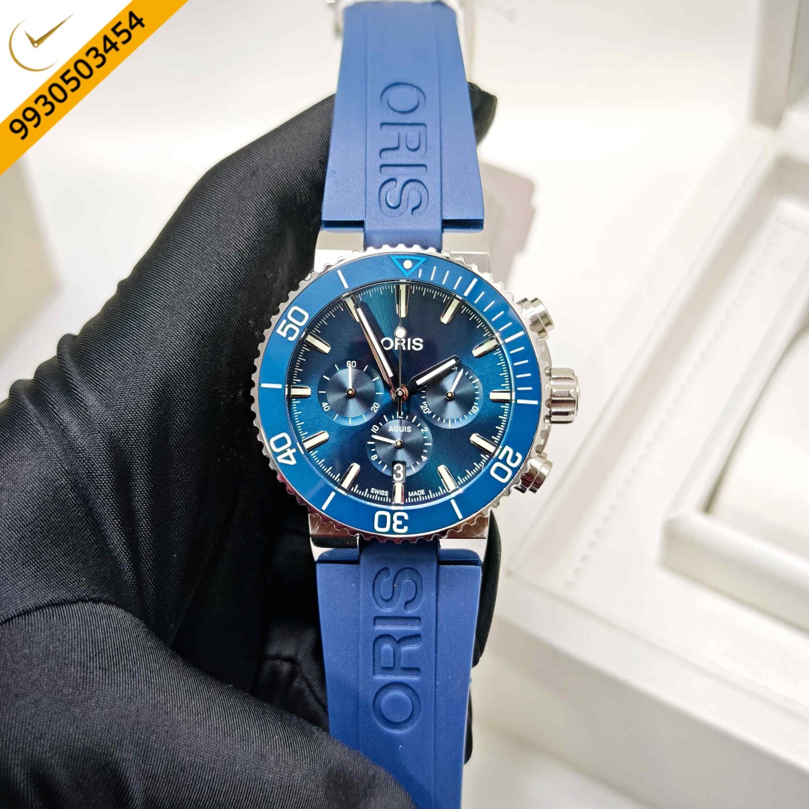 Oris Aquis Chronograph Blue Whale Limited Edition Swiss watch featuring a blue dial, stainless steel case, blue rubber strap, automatic chronograph movement, and professional diving design.