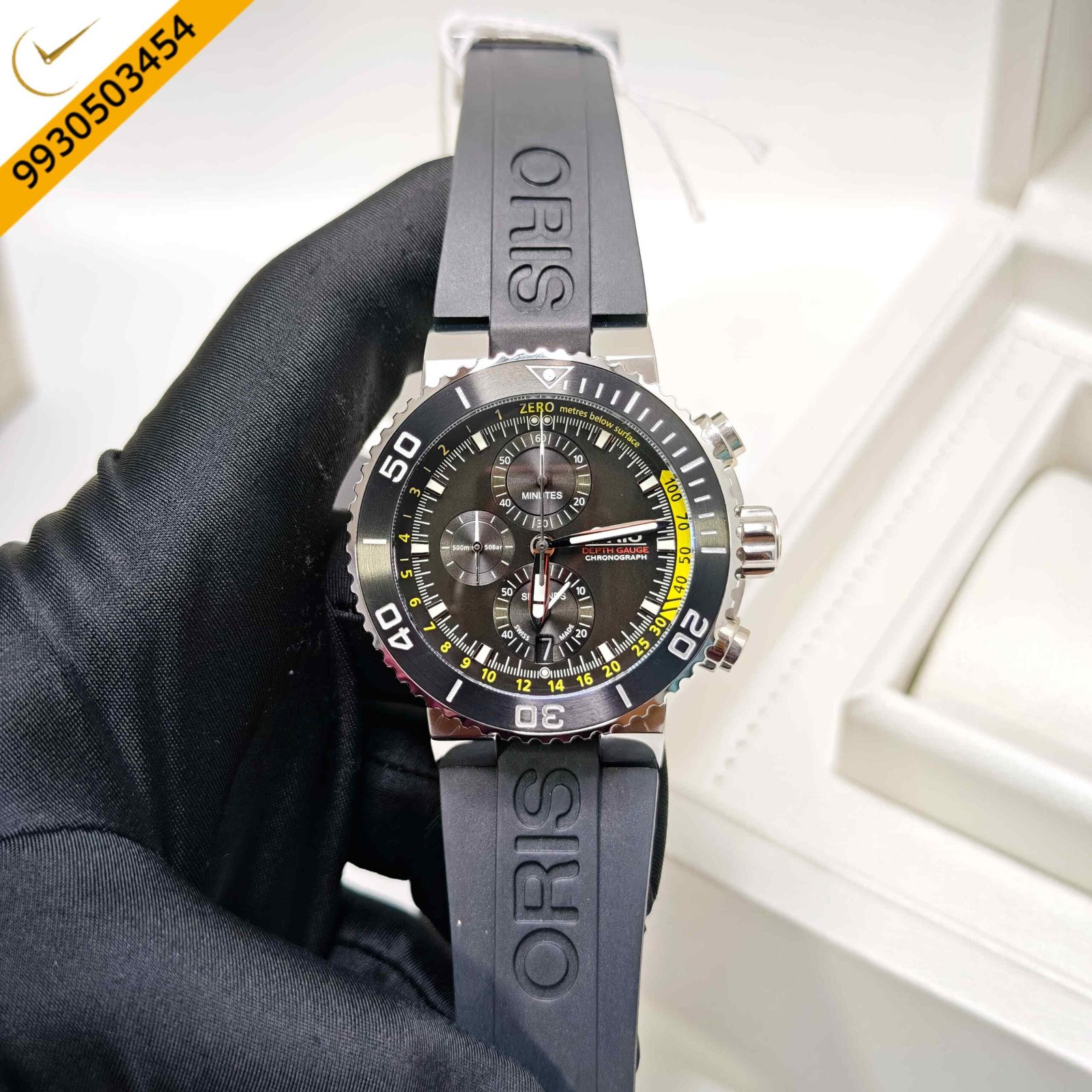 Oris Aquis Depth Gauge Chronograph stainless steel Swiss watch with a black dial, integrated black rubber strap, professional dive depth gauge, and sporty luxury design.