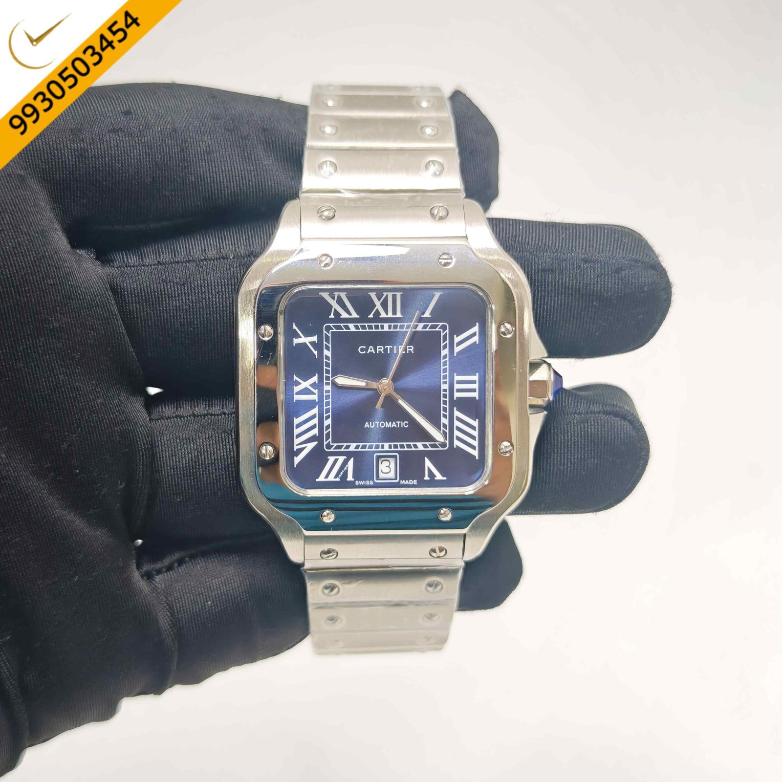 Cartier Santos De Cartier stainless steel Swiss automatic watch featuring a striking blue dial, iconic square case, polished steel bracelet, and luxury automatic movement.