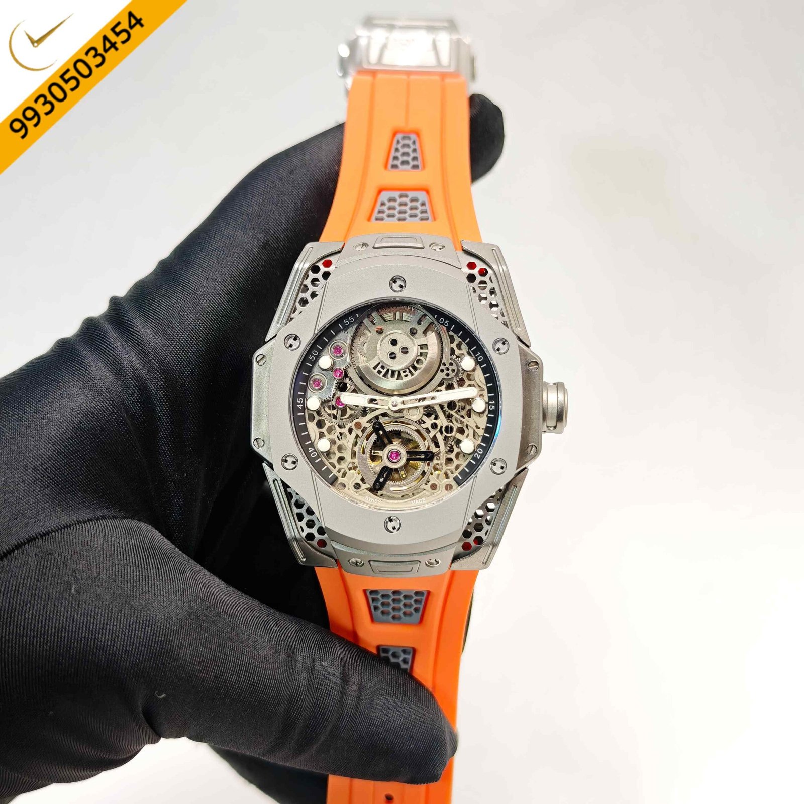 Hublot Limited Edition Big Bang Tourbillon Samuel Ross Swiss automatic watch featuring a steel case, skeleton dial, vibrant orange rubber strap, and precision Swiss tourbillon movement.