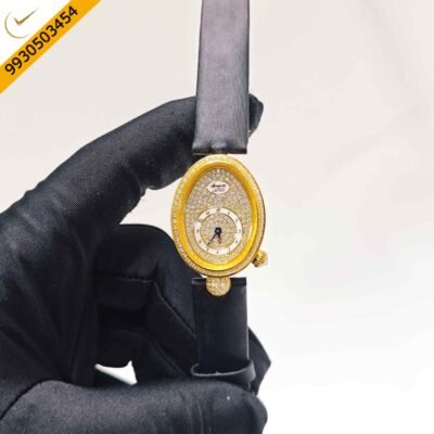 Breguet Reine de Naples luxury gold watch featuring a full diamond-set case and dial, premium leather strap, Swiss ETA quartz movement, and an elegant oval design for women.