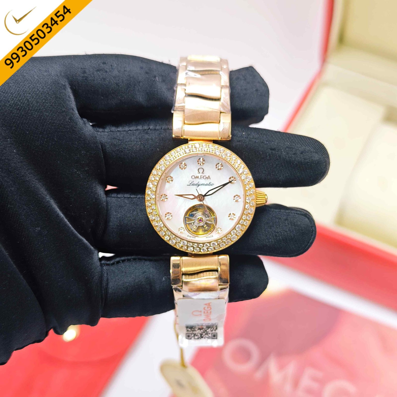 Omega De Ville Ladymatic Tourbillon stainless steel and gold-tone automatic watch featuring a white dial with diamond hour markers, Swiss Semi ETA automatic movement, and an elegant luxury ladies' design.