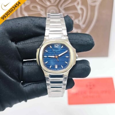 Patek Philippe Nautilus stainless steel watch featuring a blue dial, integrated steel bracelet, Swiss Semi ETA quartz movement, and iconic luxury sports watch design.