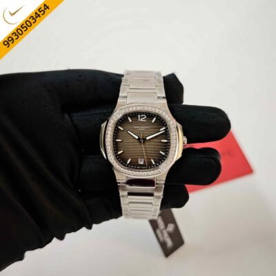 Patek Philippe Nautilus stainless steel watch featuring a sophisticated grey dial, diamond-set case, semi ETA quartz movement, and iconic luxury sports watch design.