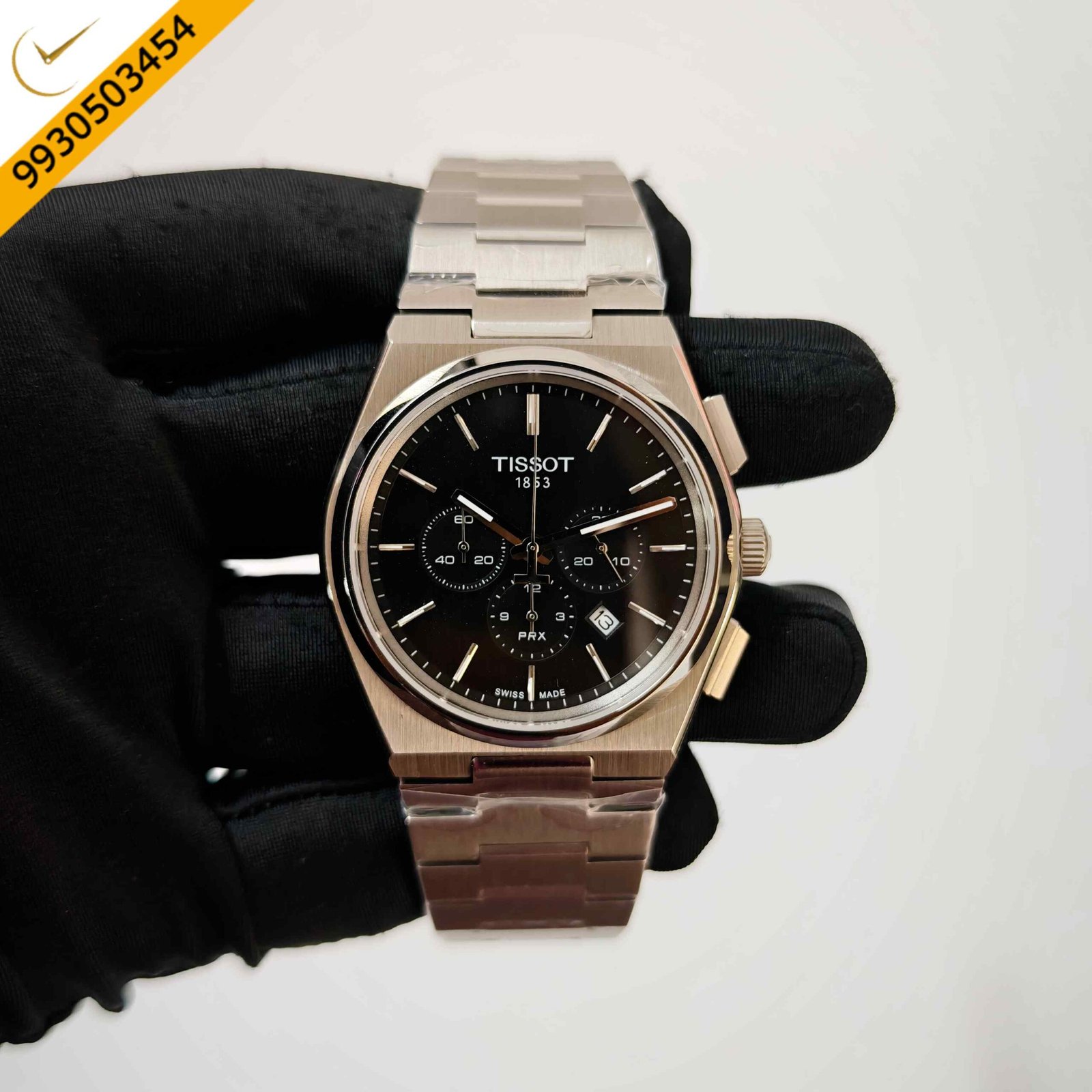 Tissot PRX Chronograph stainless steel watch featuring a black dial, integrated steel bracelet, precision Swiss chronograph movement, and sporty luxury design