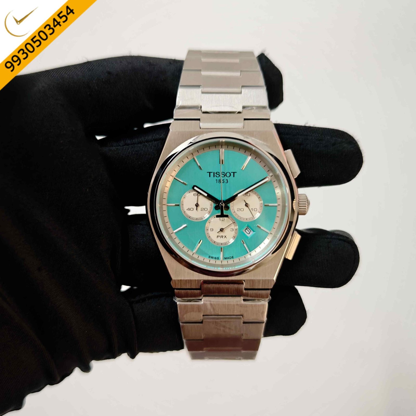 Tissot PRX Chronograph stainless steel Swiss watch featuring a vibrant turquoise dial, integrated steel bracelet, chronograph function, and premium Swiss craftsmanship.