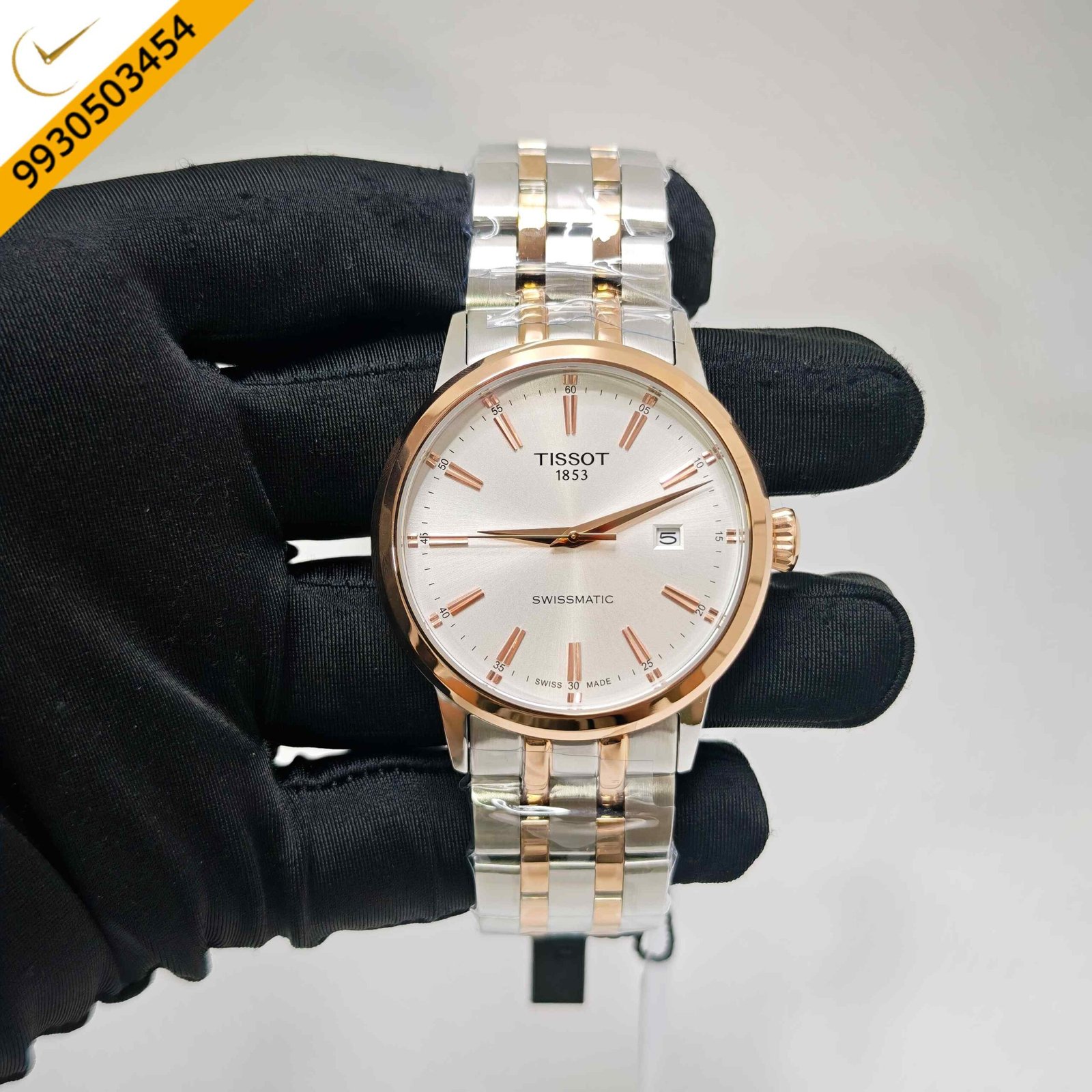 Tissot Classic Dream Swissmatic automatic watch featuring a dual-tone stainless steel and rose gold bracelet, elegant white dial, sapphire crystal, and Swiss automatic movement.