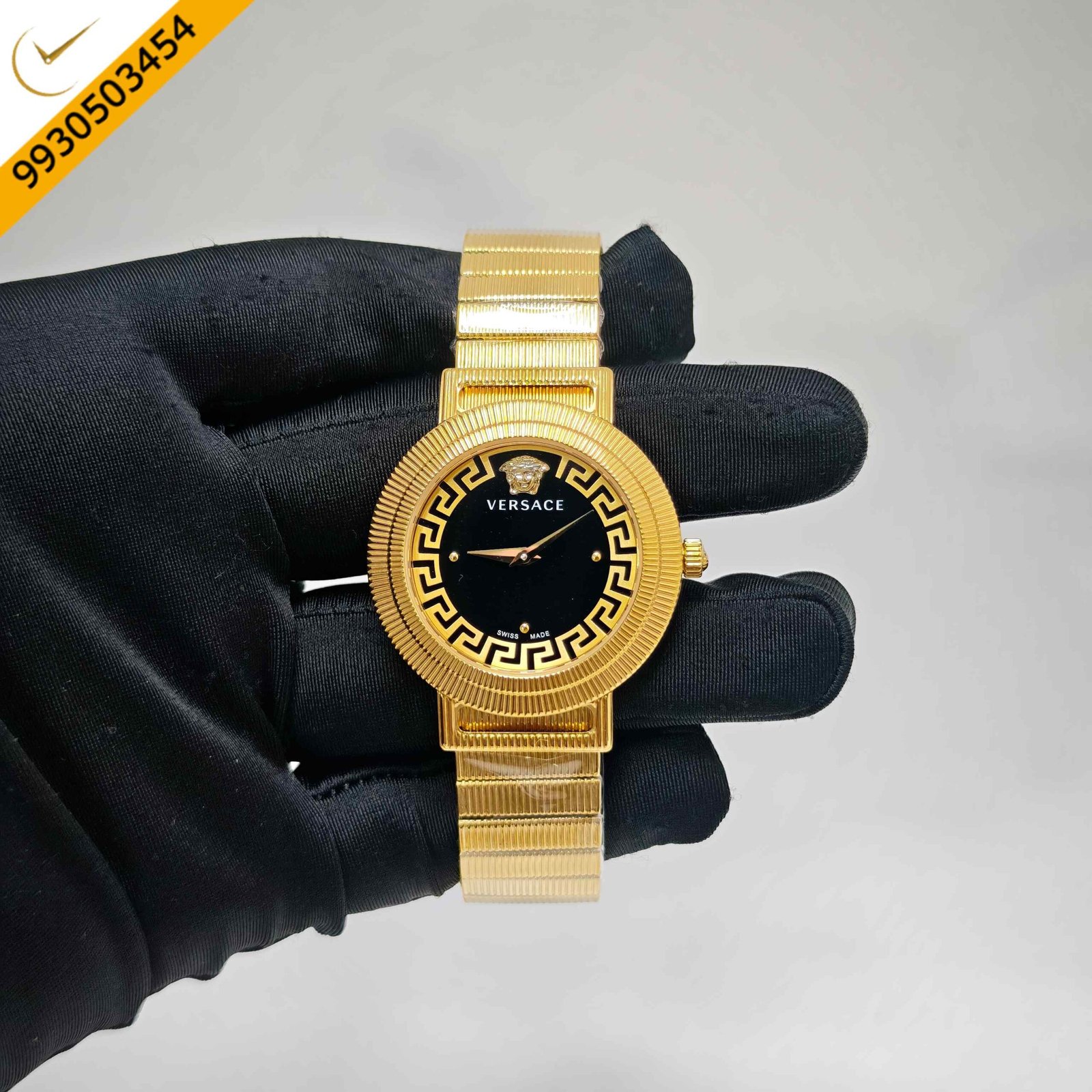 Versace Greca Chic Swiss quartz watch featuring a polished gold-tone case, elegant black dial, signature Greca detailing, sapphire crystal, and precision Swiss quartz movement.