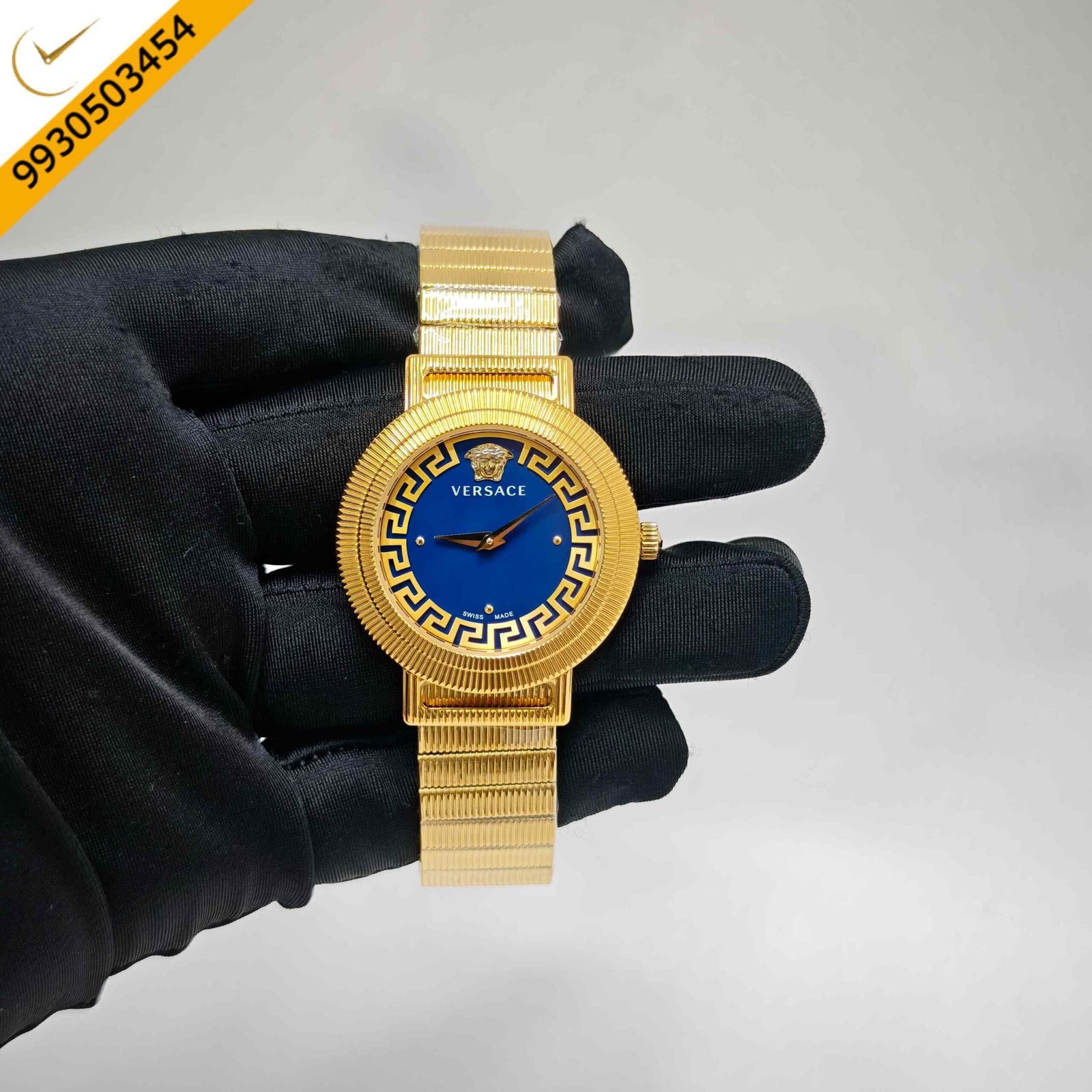 Versace Greca Chic Swiss quartz watch featuring a polished gold-tone case, elegant blue dial, signature Greca detailing, sapphire crystal, and precision Swiss quartz movement.