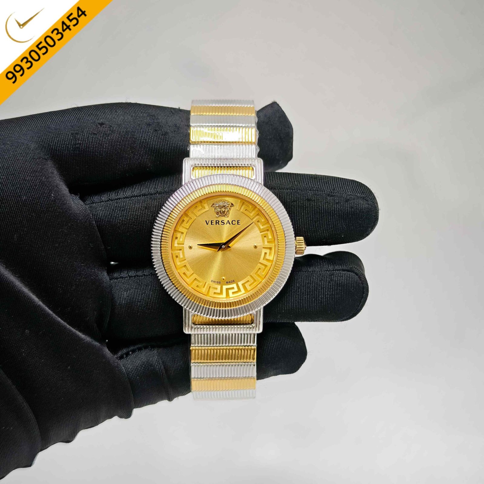 Versace Greca Chic Swiss quartz watch featuring a dual-tone stainless steel and gold case, luxurious gold dial, signature Greca detailing, sapphire crystal, and precision Swiss quartz movement.