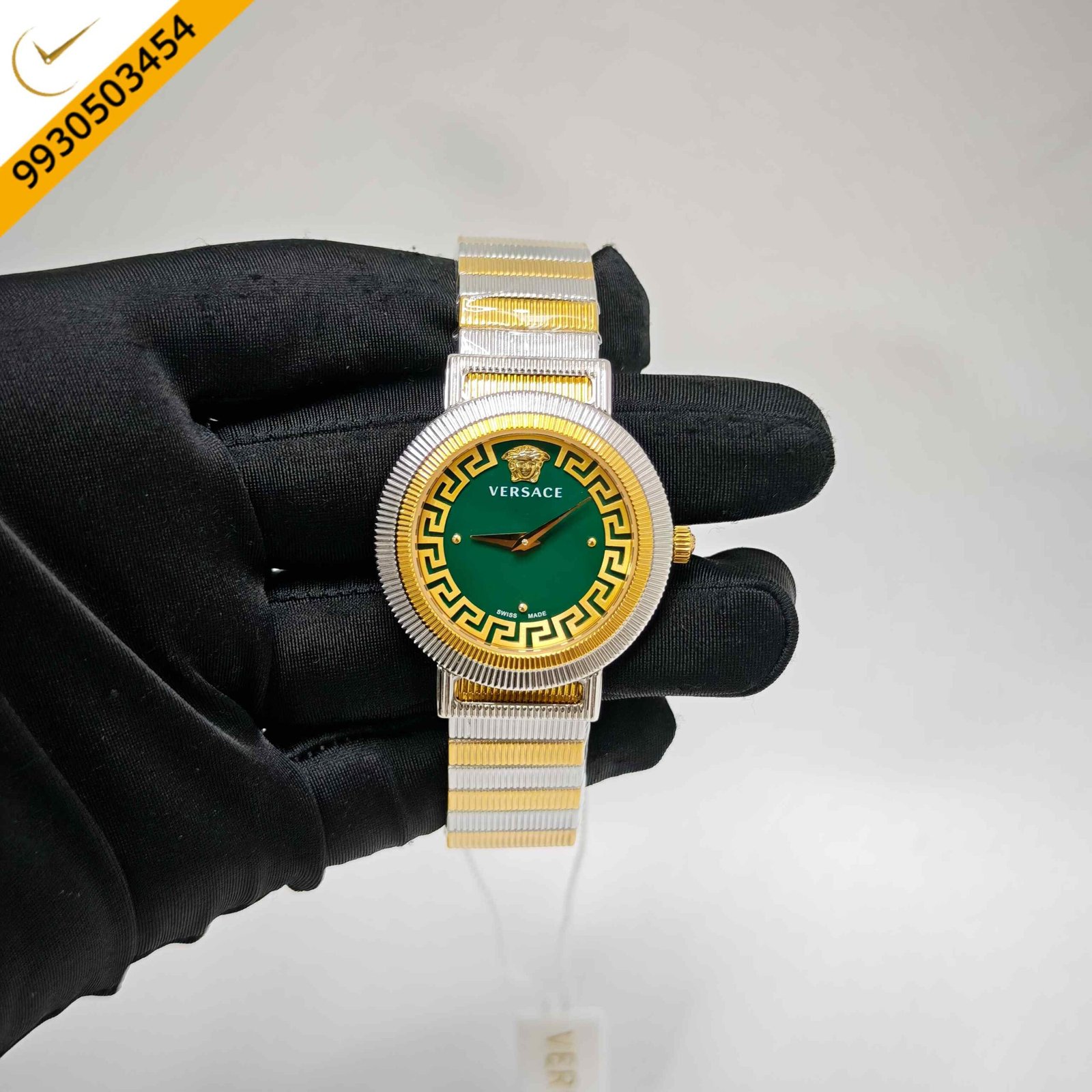 Versace Greca Chic Swiss quartz watch featuring a dual-tone stainless steel and gold case, rich green dial, signature Greca detailing, sapphire crystal, and precision Swiss quartz movement.